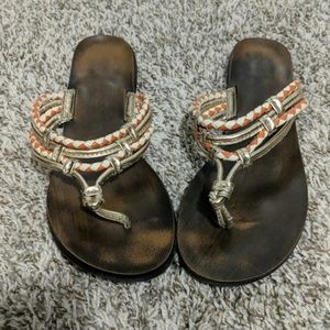 Gold, cream, and orange sandals